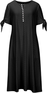 Close-up of black V-neck dress with white button details and tie-up bow sleeves