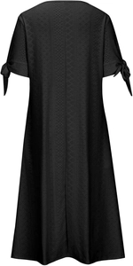 Detail of black eyelet dress showing button-up V-neck and knotted bow cuffs