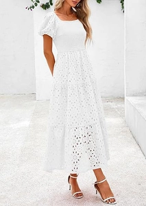 Detailed close-up of intricate white eyelet embroidery on a square-neck puff sleeve dress