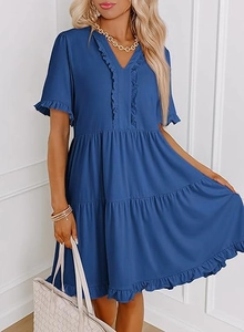 Close-up of elegant V-neckline and ruffled sleeve details on a Prussian blue dress