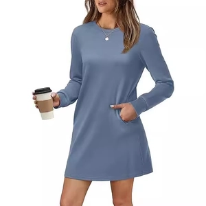Blue long sleeve crewneck dress with pockets and ribbed cuffs in a soft knit fabric