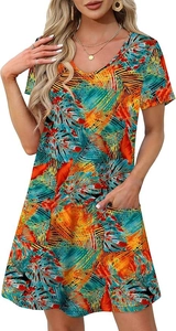 Close-up of tropical palm leaf print dress with V-neckline and functional front pockets
