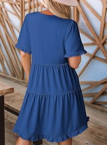 Rear view of a navy blue multi-layer ruffled mini dress with layered hem details