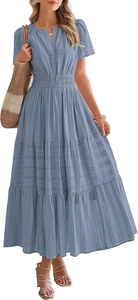 Detail of light blue tiered dress featuring V-neck and puff sleeves with textured fabric