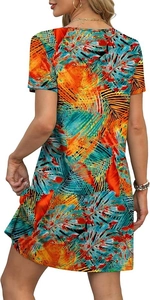 Rear view of a short-sleeved mini dress featuring vibrant tropical leaf print patterns