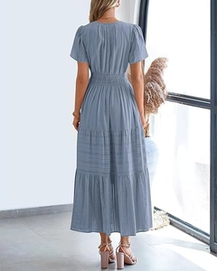 Detail of light blue tiered maxi dress with back V-neck and elastic waist design