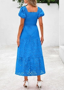 Detailed back view of bright blue square neck dress with smocked bodice and puff sleeves