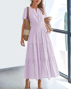 Detail of lavender V-neck maxi dress featuring pleated puff sleeves and tiered skirt texture