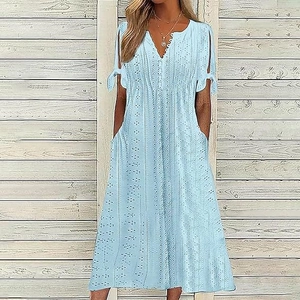 Detailed eyelet embroidery and tie-knot cuff design on a light blue V-neck midi dress