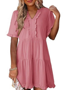 Detail of V-neckline with ruffles and tiered skirt on this pink mini dress for women