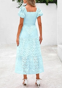 Detail of smocked back design and eyelet embroidery on a puff sleeve midi dress