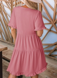 Back view of pink tiered mini dress featuring ruffled short sleeves and A-line silhouette