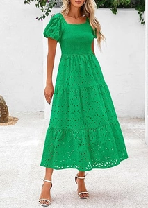 Detail of smocked waist and eyelet embroidery on a green square neck tiered dress