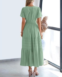 Back view of light green tiered maxi dress with short sleeves and high waist design