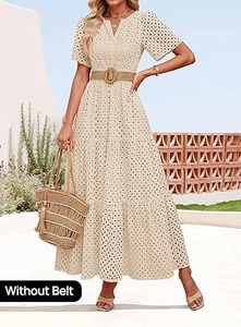Dettaglio del ricamo con scollo a V e gonna a balze su un abito midi bianco boho