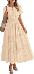 Macro detail of beige tiered maxi dress featuring subtle horizontal textured fabric