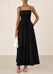 Close-up of a black pleated smocked maxi dress with thin straps and side pockets