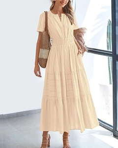 Detail of V-neck short sleeve apricot dress with elastic waist and layered hem design