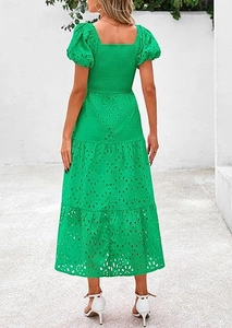 Detail of smocked back and eyelet embroidery on a vibrant green square neck dress