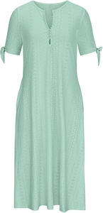 Close-up of mint green eyelet dress featuring V-neck buttons and sleeve bow ties
