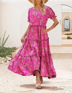 Detail of tiered ruffle skirt on a floral maxi dress with vibrant summer prints