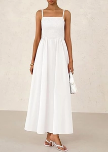 Detail of white smocked bodice and thin spaghetti straps on a summer maxi dress