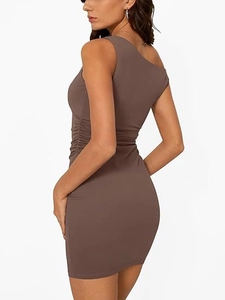 Detail of the brown off-shoulder sleeveless dress with elegant side ruched fabric