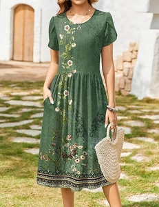Detail of dark green floral dress featuring side pockets and a casual summer design