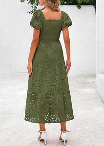 Detail of smocked back and eyelet embroidery on dark green tiered midi dress
