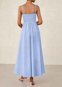 Detail of the smocked elastic back on this light blue A-line spaghetti strap maxi dress