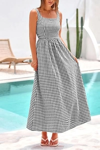 Close-up of black and white gingham dress featuring a square neck and high waist line