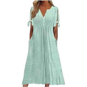 Women's V-neck mint green eyelet dress with button details and tied short sleeves