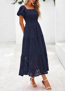 Macro detail of navy blue mesh dress showing square neck and tiered puffy sleeve texture