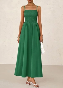 Detail of smocked dark green maxi dress featuring elastic bodice and thin straps