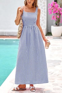 Detail of blue and white gingham maxi dress featuring thin straps and square neckline