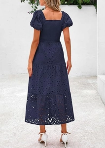 Detail of navy blue puff sleeve dress with floral eyelet embroidery and square neckline