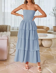 Detail of light blue tiered smocked strapless dress with ruffled layers and a long flowy hem