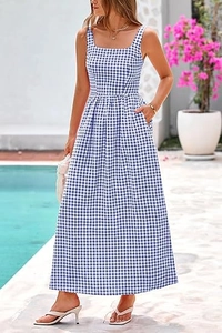 Detail of blue and white gingham maxi dress featuring square neck and side pockets