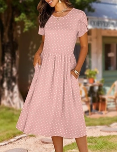 Detail of pink polka dot short sleeve dress showing round neck and functional side pockets