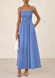 Detailed view of the smocked bodice and thin straps on this light blue summer dress