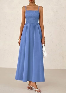 Detail of smocked bodice and thin straps on a sky blue midi dress with elegant flow