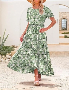 Detail of tiered damask maxi dress with puff sleeves and retro green floral print