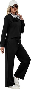 Détail d'un ensemble de sport noir avec haut à manches longues et pantalon large fluide