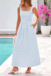 Detail of a blue gingham maxi dress featuring a square neck and functional side pockets