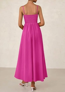 Detail of smocked elastic back and spaghetti straps on a rose red maxi dress