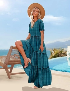 Detail of teal plaid tiered maxi dress with ruffle sleeves and elastic waist design