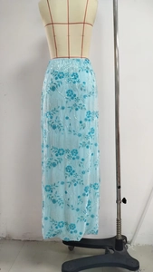 Detailed view of light blue maxi skirt with delicate sequin floral embroidery and tulle