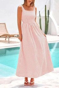 Detail of pink gingham maxi dress featuring square neckline and wide straps for summer