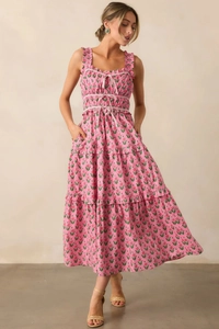 Detail of pink floral dress featuring ruffled straps and multi-layer drawstring bodice