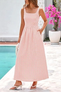 Detail of pink gingham maxi dress featuring a square neckline and gathered waist pockets